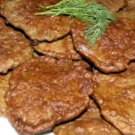 Язик з грибами під горіховим соусом
