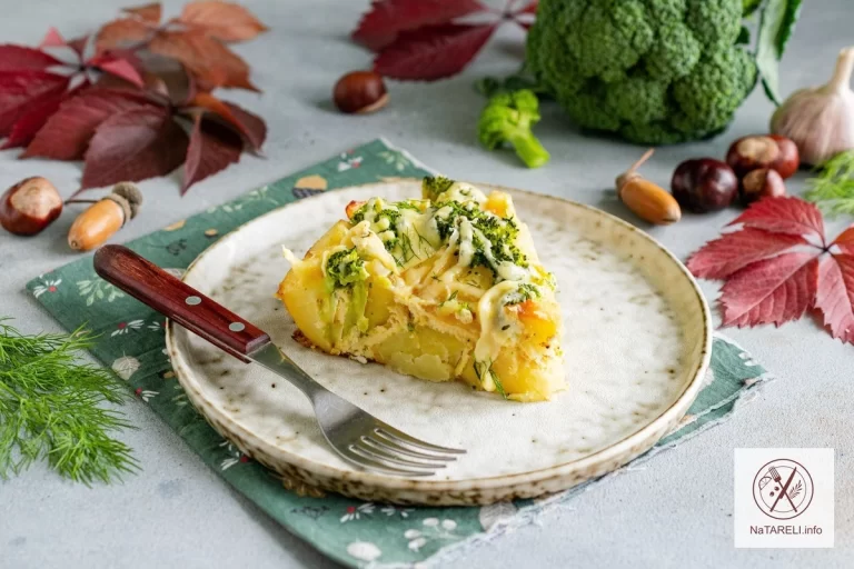 Potato casserole with broccoli and hard cheese in the oven