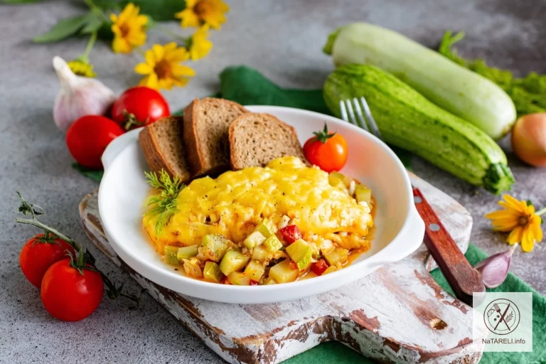 Zucchini with eggs and hard cheese in the oven