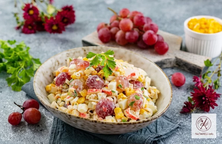 Salad with crab sticks, corn and grapes